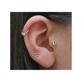 14K Gold Tragus Piercing With One Stone In The Middle
